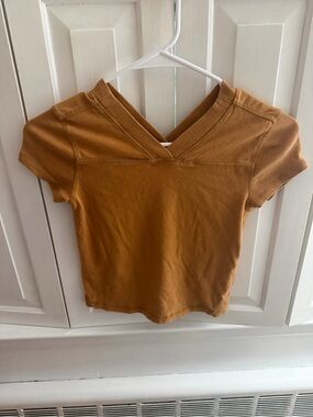 Free People Short Sleeve V-Neck Tee in Rusty Mustard